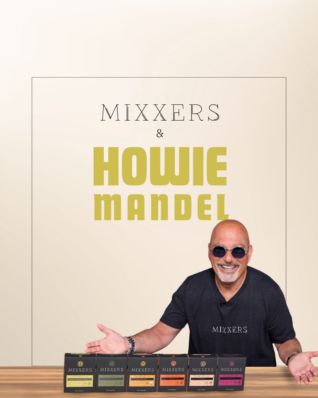 Howie Mandel standing behind a bar with Mixxers cocktail and mocktail mixers.
