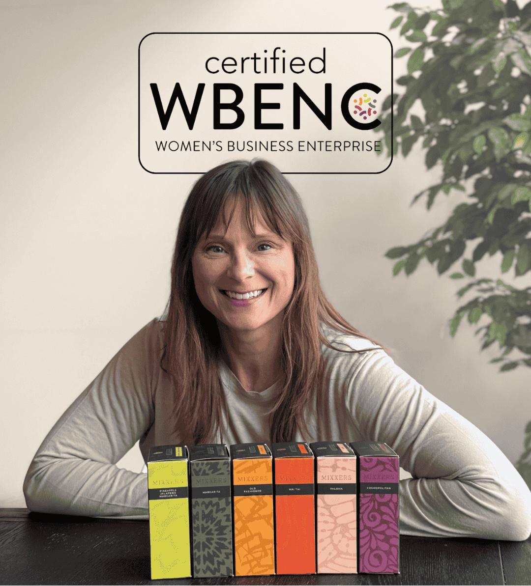 Kara Potter - founder of Mixxers with a stack of colorful boxes and 'certified WBENC Women's Business Enterprise' logo.